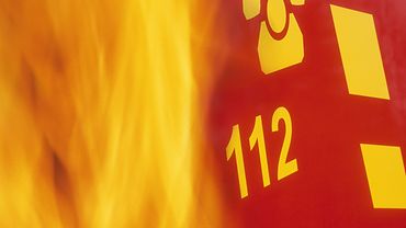 Flammen mit Symbol für Notruftelefon 112