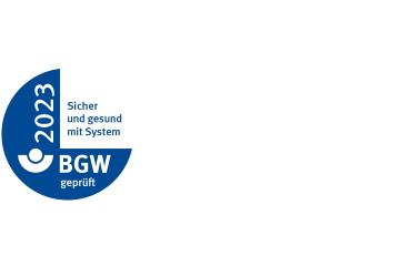 BGW AMS - Prüfsiegel Logo vom BGW AMS mit dem Text "Sicher und gesund mit System"