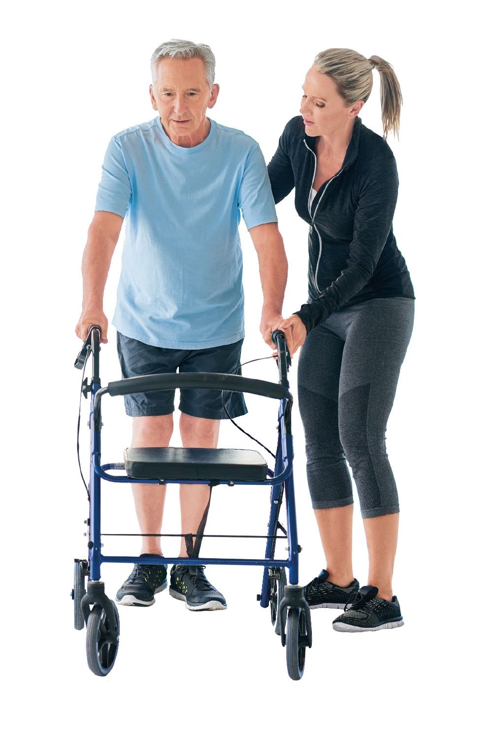 Hilfsmittel in der Pflege Eine junge Frau unterstützt einen älteren Mann dabei, sich mit dem Rollator fortzubewegen.