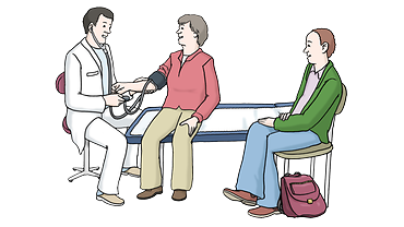 Ein Arzt untersucht einen Patienten.